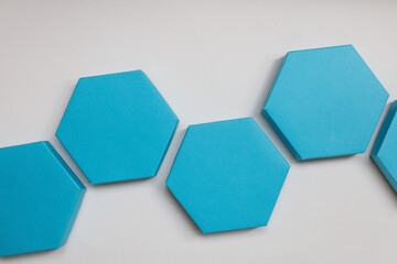 A beautiful blue hexagon boxes of present on the white background. Flat lay. Place for text. Empty boxes.
