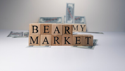 The word Bear market in wooden cubes, in white background.