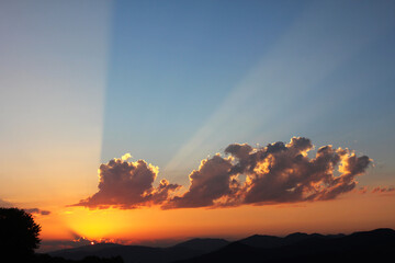 Mountain cloudscape and landscape in Georgia. Sunset colors and time.