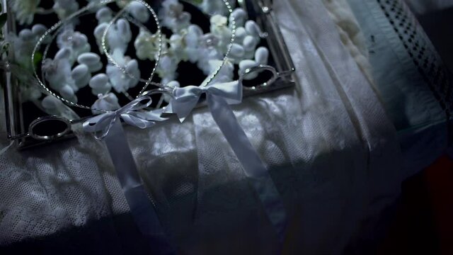 Wedding table with dragees and crowns on it, in the Church