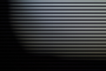 blinds in dim light. Texture or background. Abstraction. Blinds on the window. Gray depressed background