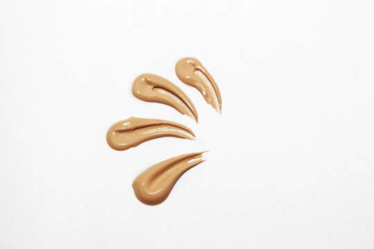 Liquid foundation for makeup. For foundation smudges on a white background.