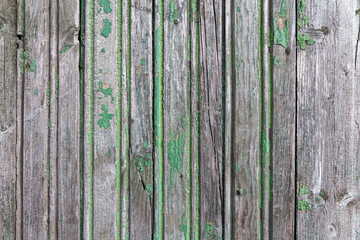 Wooden boards with the remains of old green paint