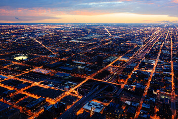 Chicago city skyline panorama aerial view at night sunset and Orange street light looks like a line to the sky 