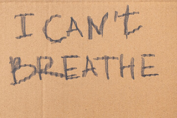 I cant't breathe words written on cardboard closeup