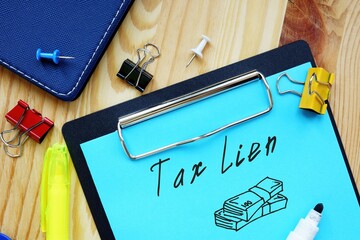 Financial concept meaning Tax Lien with sign on the page.