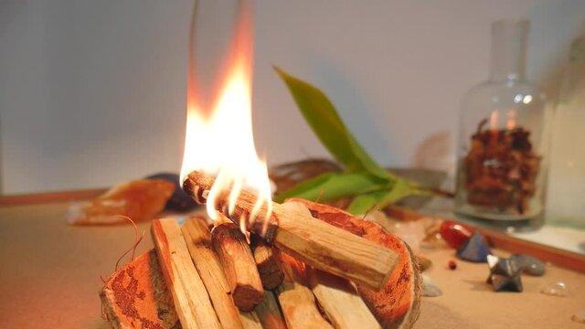 Palo Santo on Fire Burning with Smoke Clearing Energy Work Clearing Space of Negative Vibes Healing the Room Aura in Spiritual Meditation Ritual Flame Bathing in 4k