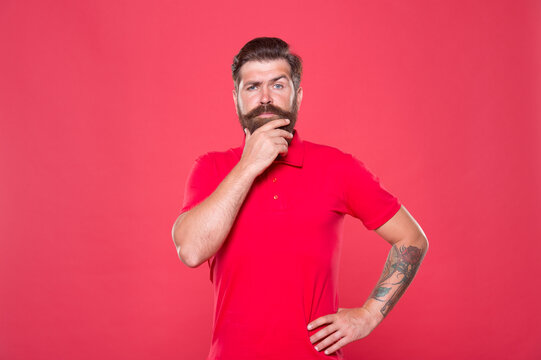 Why so serious. Serious look of brutal hipster. Bearded man think red background. Serious and thoughtful. Thinking on problem. Solving problem. Dilemma. Thoughtful and serious. Use your brains