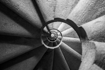 Winding and spiralling concrete staircase in a tower, with infinity point