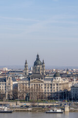 Gresham Palace with St. Stephen's Basilica on Danube riverside in Budapest winter morning