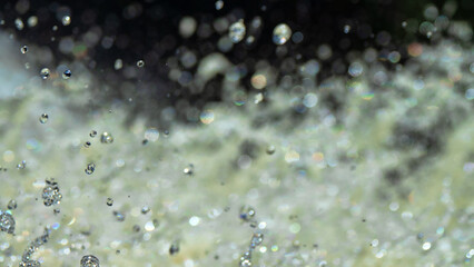 Water backgrounds with foam spray fast flow.