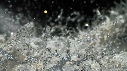 Water backgrounds with foam spray fast flow.