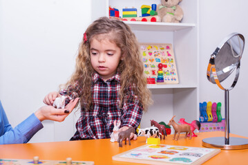 Portrait of a little girl at a speech therapist