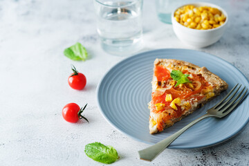 Onion tomato cream cheese whole grain galette in a plate