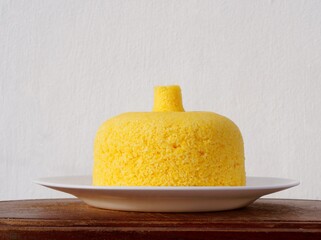 Couscous on wooden board. Brazilian couscous (Cuscuz Brasileiro).
