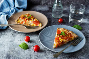 Onion tomato cream cheese whole grain galette in a plate