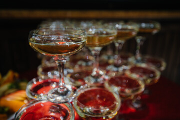 Festive glasses on the festive table during the Banquet. Alcoholic beverage