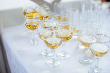 Festive glasses on the festive table during the Banquet. Alcoholic beverage