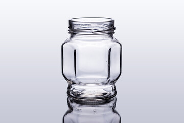 Empty open glass jar with reflection and clipping path