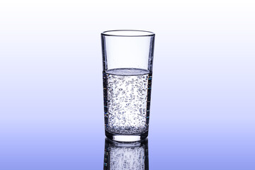 Pure drinking water with gas bubbles in a glass beaker