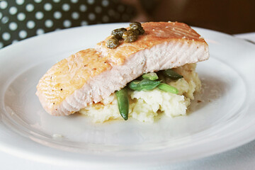 Salmon steak with mashed potatoes and beans 