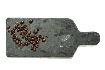 Coffee beans on the stone board and white background. 