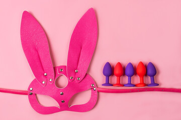 on a pink background sex product, toy for adults
