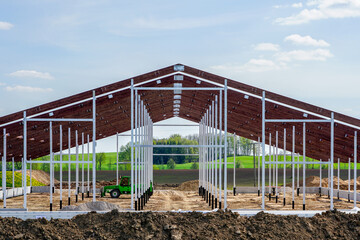 view of a new metal frame structure of an agricultural building under construction © Zigmunds