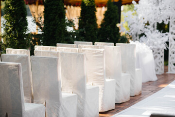 Beautifully decorated and arranged chairs for a festive Banquet. Decor, wedding