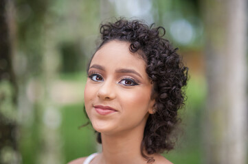 beautiful Brazilian teenager in nature close-up. Great copy space.