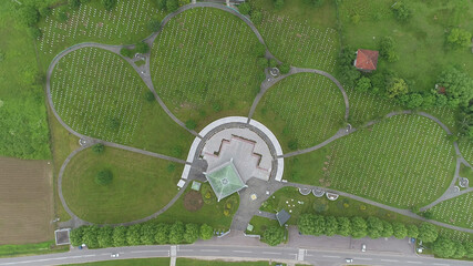 Srebrenica, Bosnia-Herzegovina, Juny 01 2020: Srebrenica-Potocari memorial and cemetery for the victims of the 1995 massacre, aerial view.
