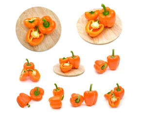 Large set of images of orange bell peppers isolated on a white background