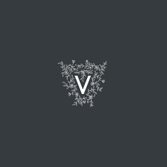 Hand drawn vector floral frame with "V" letter. Elegant floral monogram for "V".