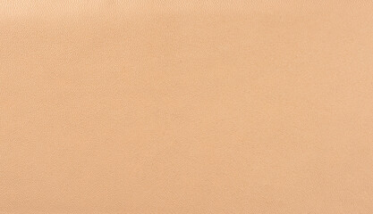 Beige leather texture background. Beige faux leather background.