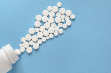White round pills in a plastic bottle on a blue background for use in presentations, manuals, design, etc. 3D illustration. Medicine concept. top view