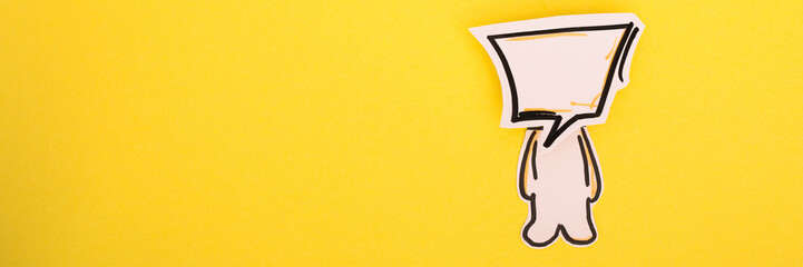 Paper human icon with speech bubble on the yellow