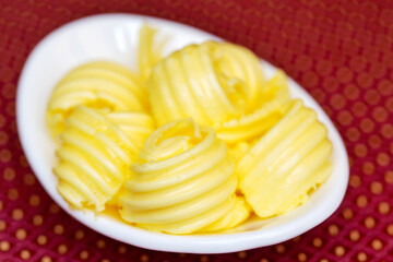 slices of butter, selective focus. As backdrop for menus, cookbooks, advertisements and other culinary projects