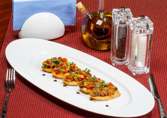 Bruschetta (Italian Toasted Garlic Bread) with stewed vegetables, selective focus. As backdrop for menus, cookbooks, advertisements and other culinary projects