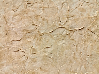 Decorative golden color plaster texture on the wall