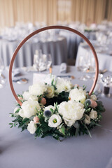 Table decoration at wedding on grey tablecloth