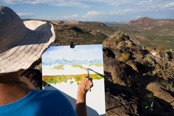 senior woman artist painting landscape, White Rock, New Mexico