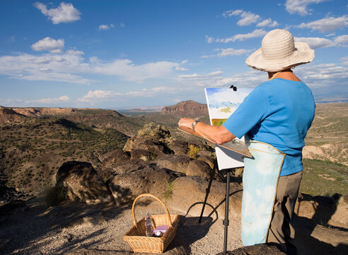 senior woman artist painting landscape, White Rock, New Mexico