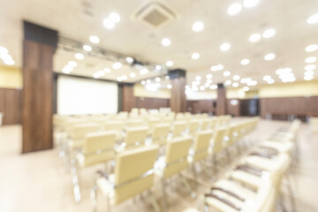 Blurred photo of empty interior of conference holl