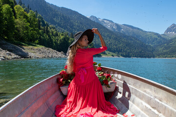 romantic scene with female model with long blond hair on a boat.