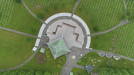 Srebrenica, Bosnia-Herzegovina, June 01 2020: Srebrenica-Potocari memorial and cemetery for the victims of the 1995 massacre, aerial view.