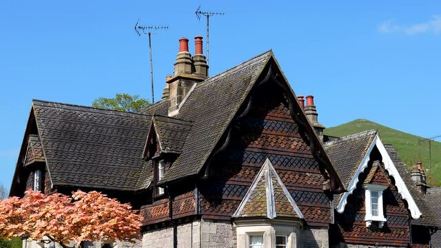 Picturesque cottages of Ilam village on a sunny day in Peak District National Park, England, UK.
