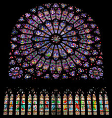 PARIS, FRANCE - SEPTEMBER 26, 2018 North Rose vitrages stained glass window in interior of cathedral Notre-Dame de Paris before fire April 15, 2019. Paris, France