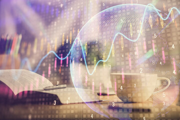 Multi exposure of forex graph drawing and desktop with coffee and items on table background....