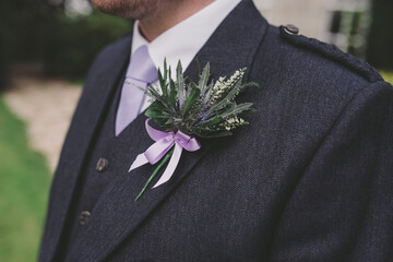 Close up of groom and buttonhole
