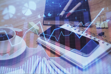 Double exposure of forex chart drawing and cell phone background. Concept of financial trading